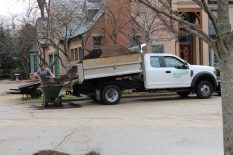 Landscaper from SanFilippo spreading soil